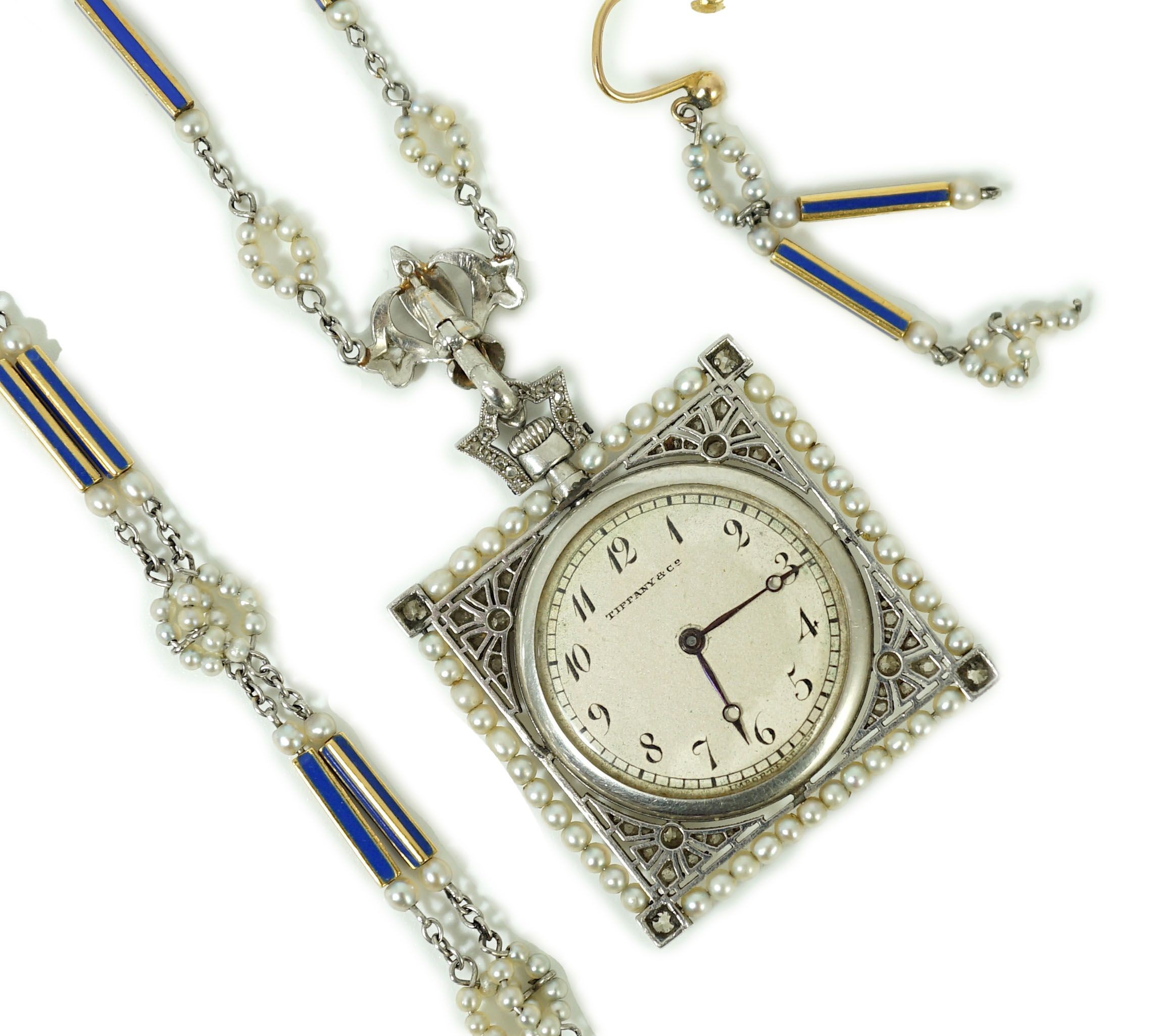 An early 20th century Tiffany & Co platinum, seed pearl and diamond set pendant square open faced dress timepiece, on a platinum, gold, enamel and seed pearl set chain, together with a matching 9ct bracelet and 9ct earri